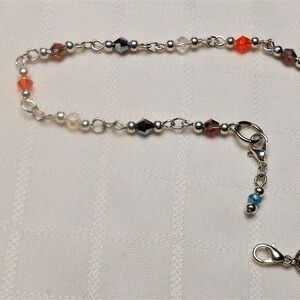 Ankle chain 10 inches long Comes with a 1-inch extensio